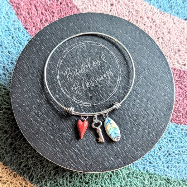 Bangle Bracelet with Ceramic Heart & Feather Charms